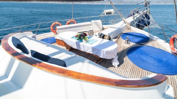 The 8-cabin gulet S-Nur Taylan in Marmaris presents a stylish deck with a comfortable seating area and a view of the sea